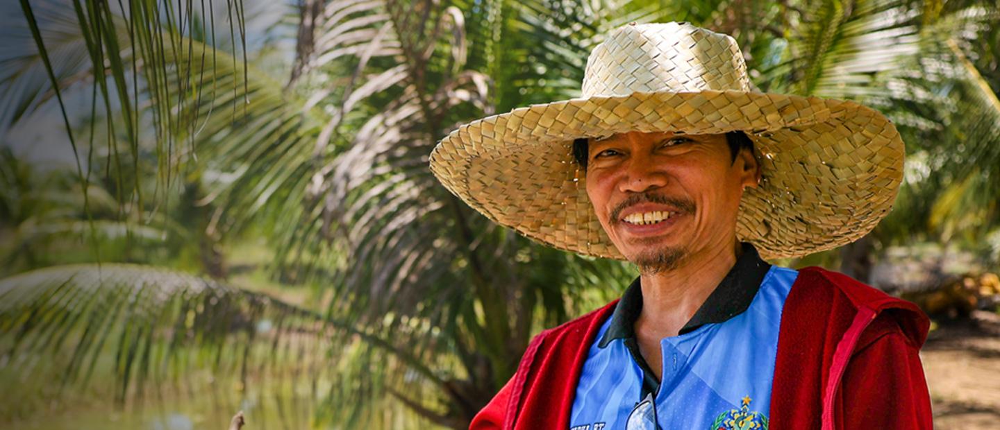 A man in a straw hat.