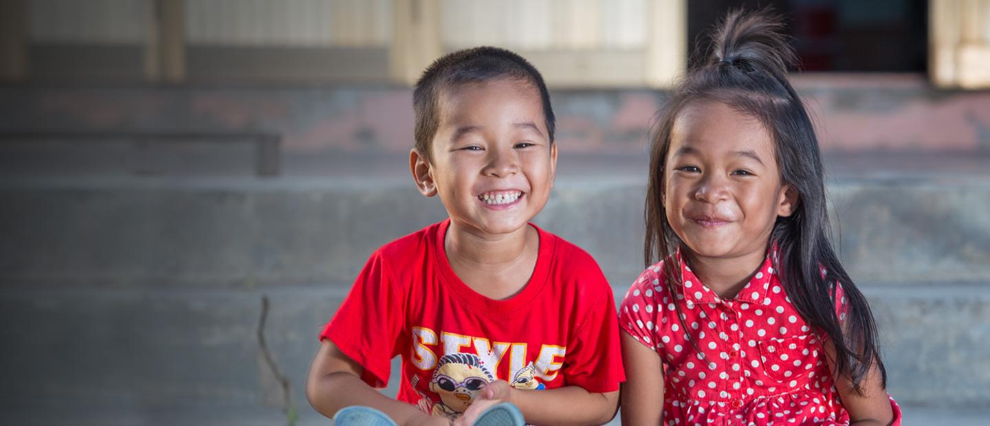 2 children sitting on the steps.
