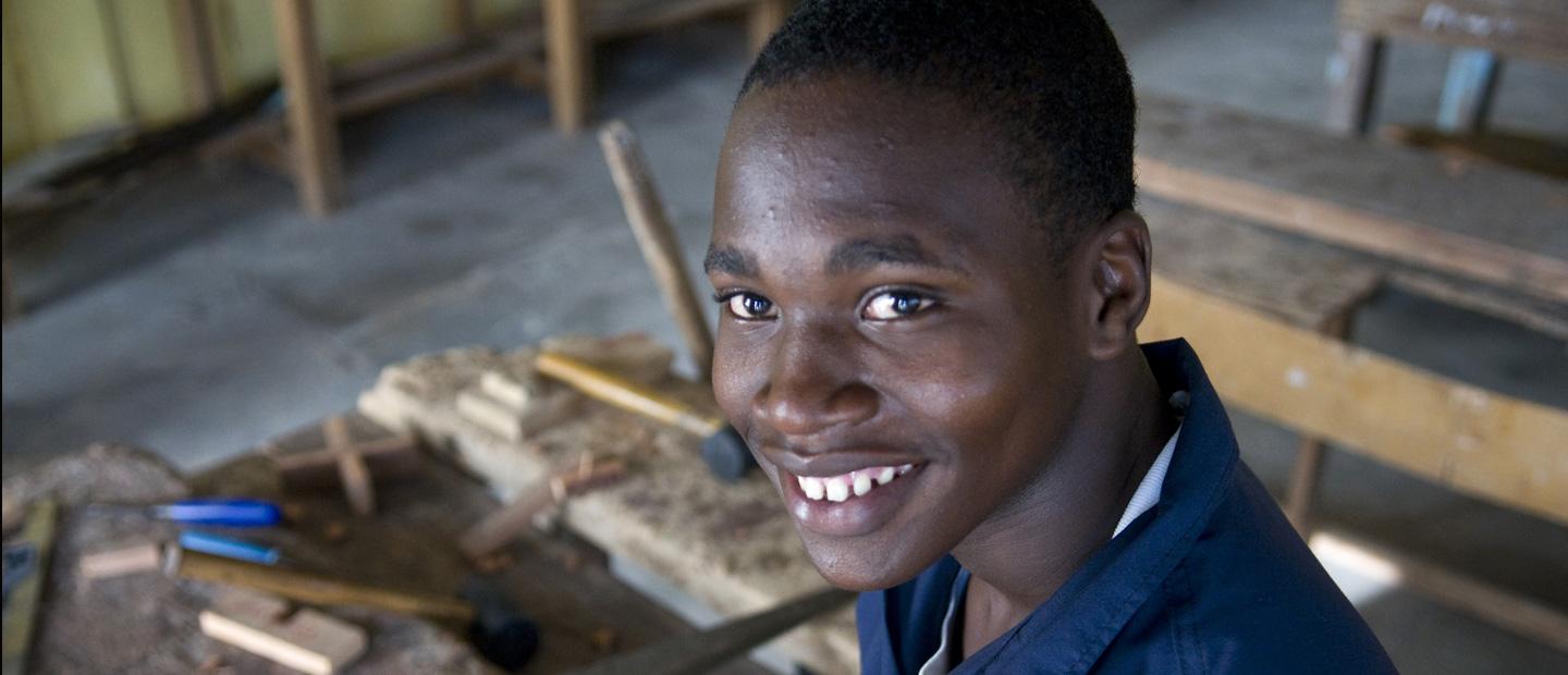 A young boy in a classroom.