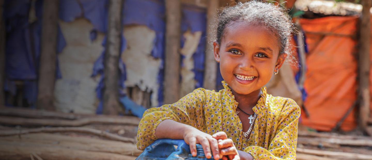 Young girl smiling.