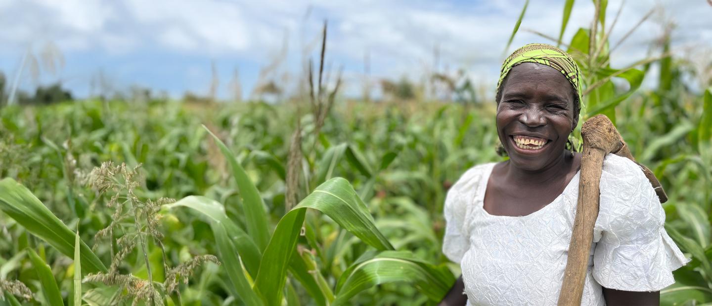woman smiling in corn field