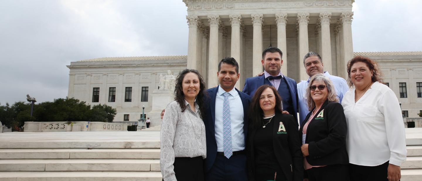 Group of people standing in front of the Capitol building in Washington, DC