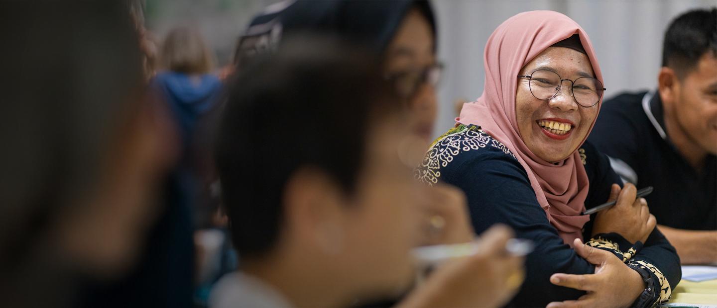 woman smiling during a meeting