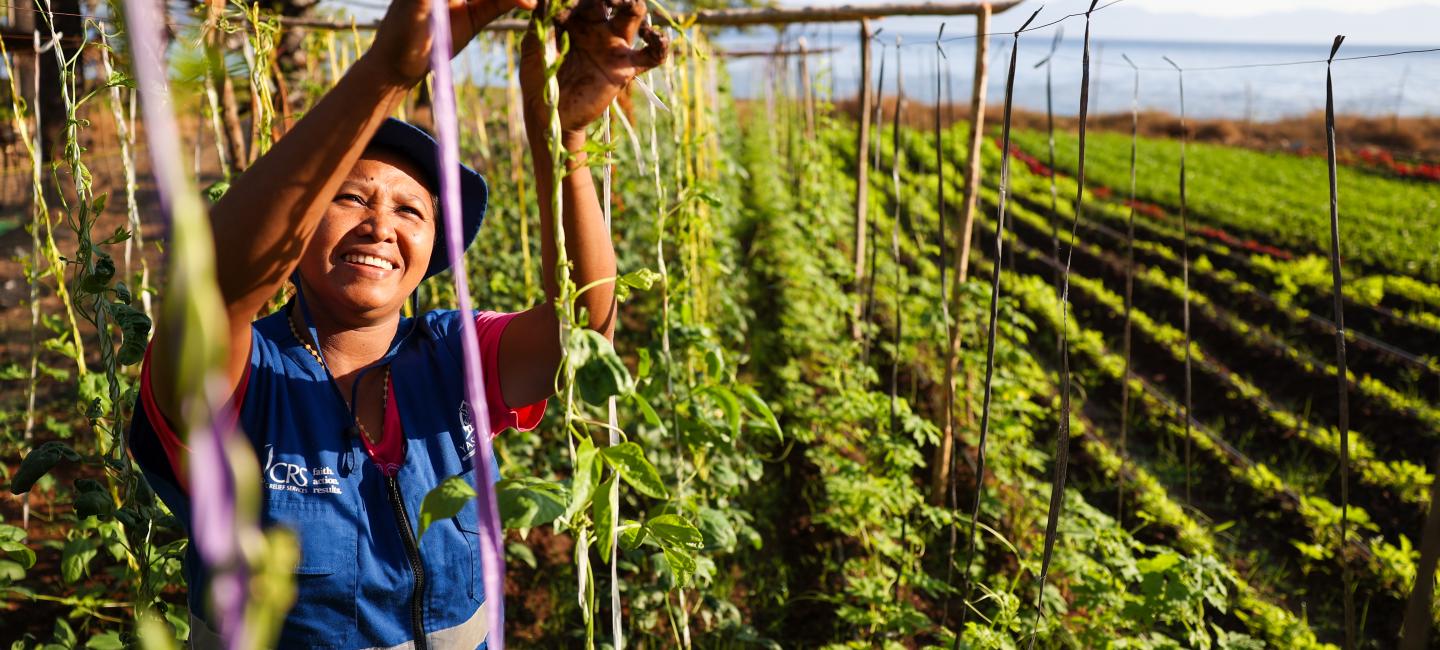 Cyclones and climate change threaten food access in Indonesia but Evita helps her community grow home gardens for sustainable, nutritious food.