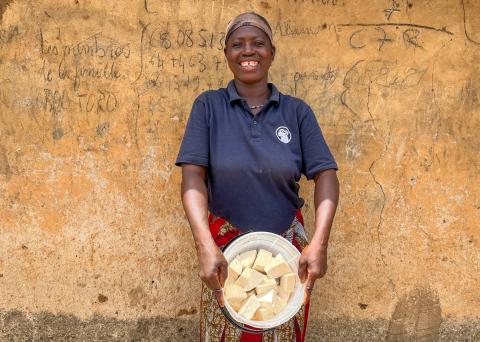 SILC member Aissatou Zakari displays her finished soy cheese.