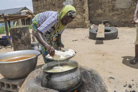 preparing soy bean paste in Benin