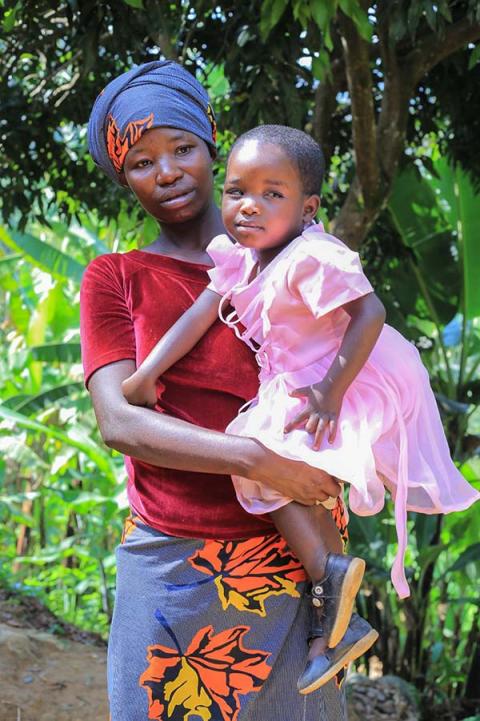 A woman holding a child.