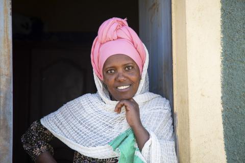 Sesen Kiros Woldetekle stands at the door of her home near Mekelle city in Ethiopia.
