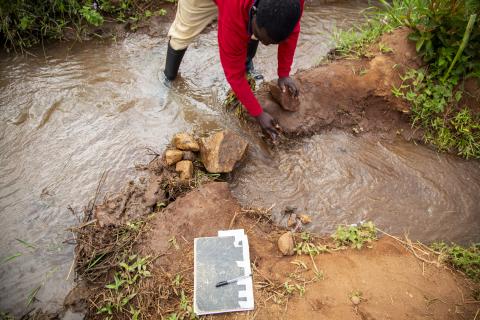 Wilfred Charles opens an irrigation channel for farms in Lingoni, Malawi