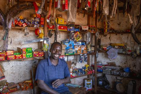 Edwin Mbalama tends his shop in Lingoni, Malawi