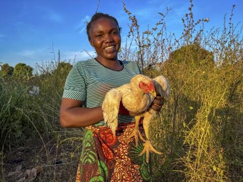 Judith Koumangou holds one of her nine chickens