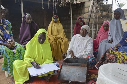 Women and men sitting together.