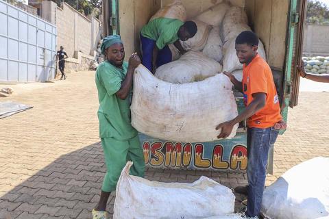 Men unloading a truck.