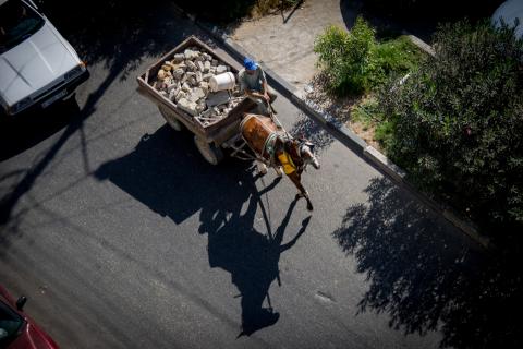 Horse carrier in traffic.