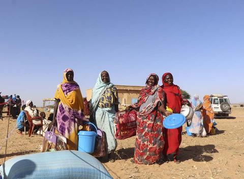 Women with water bins.