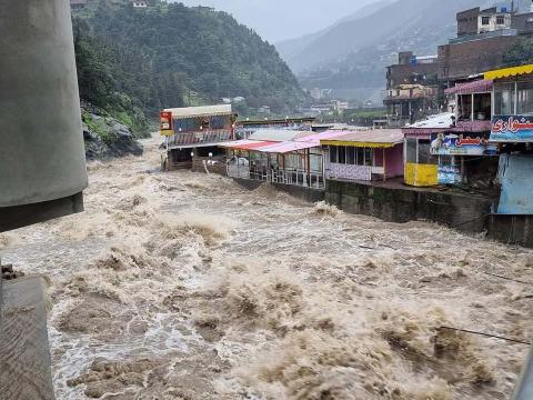 River flood around buildings.