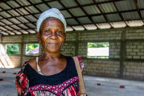A woman with white headband.