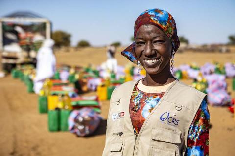 A woman smiling.