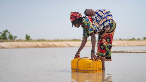 woman collecting water