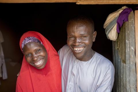 A man and a woman hugging.