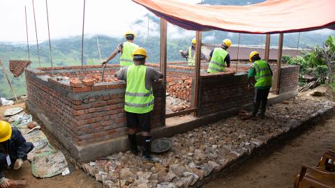Workers building a house.