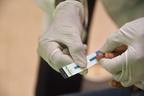 A person holding a test.