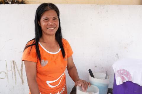 A woman in orange shirt.