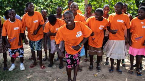 Children in orange shirts.