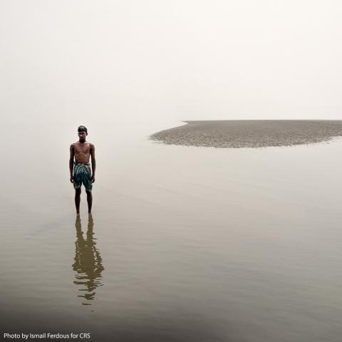 A man standing in the water.