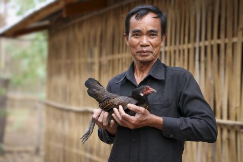 Man holding chicken