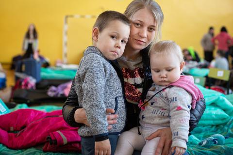 Mother holding children