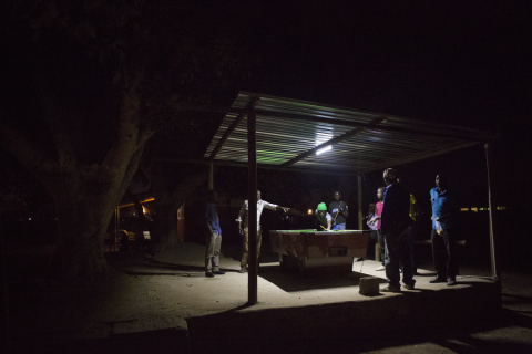 Young people playing pool.