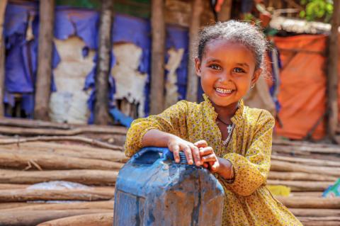 Young girl smiling.