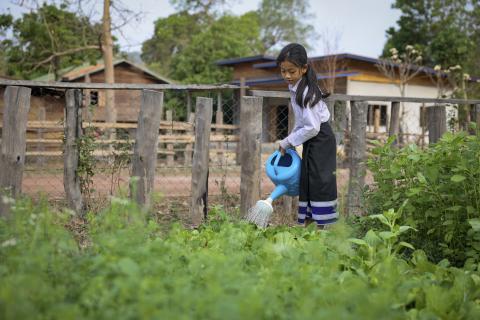girl watering garden