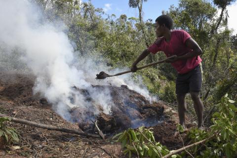 young man creating charcoal