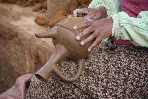 Woman making ceramic jug