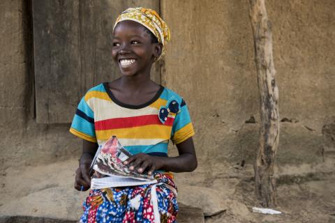 A girl with her school book.