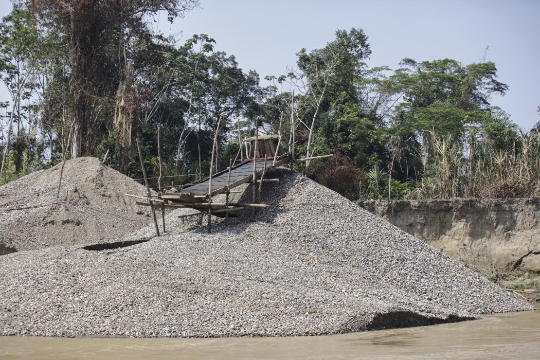 Miners call this "the beach." Located on the river's edge, it is the leftover rocks, gravel and sand from the gold mining process. Photo by Oscar Leiva/Silverlight for CRS