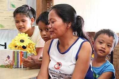Josefa Alvero, and her two sons and niece were relocated from their coastal community. They now call a storm-resistant shelter built by CRS their home. 