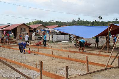 CRS is working with volunteers to construct recreational facilities, like playgrounds and basketball courts, so children have a place to play.