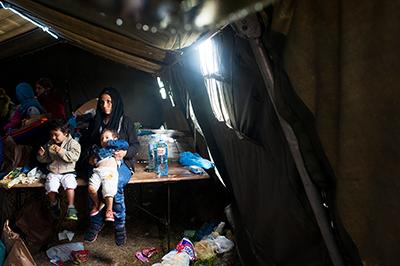 Families, although relieved to have made it to a safe continent, are physically spent. Few stop at refugee sites or transit camps for long. They rest for a few hours, maybe a day, determined to keep moving. Photo by Kira Horvath for CRS