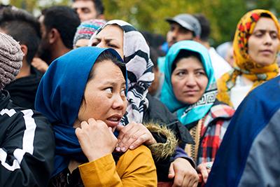 Refugees line up for a distribution of relief items in Belgrade. CRS is working with Church partners in Serbia—as well as Greece, Albania and Macedonia—to provide food, basic living supplies, and medical and legal support. Photo by Kira Horvath for CRS