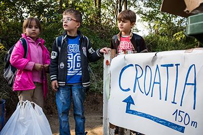 We met Ibtissam, Adel Rahma and Ibrahim near the Croatian border in Serbia. The three siblings from Damascus, Syria, had been traveling for 2 weeks from their temporary home in Turkey. Photo by Andrew McConnell for CRS