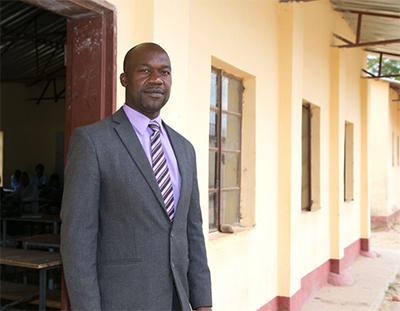 David Mwaitomupi, acting principal at Chidoma Secondary School, says even students who continue to attend may fall unconscious at school from hunger. Students may walk for several hours to school and back with empty stomachs. Photo by Nancy McNally/CRS