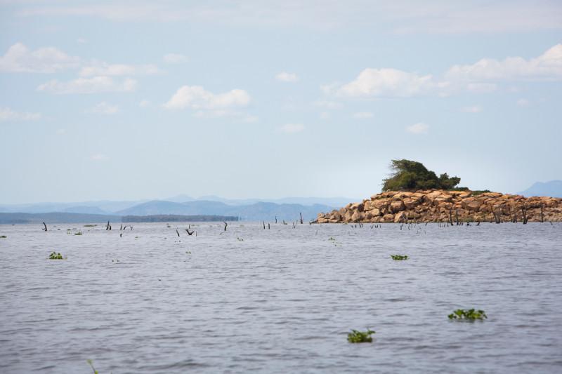 Decreased water levels due to the drought have allowed land to rise to the surface on Lake Kariba. This can be dangerous for boaters. Photo by Elie Gardner for CRS 