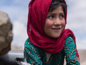 Afghan girl washing her hands