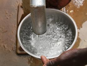 In Burkina Faso, community members use a community borehole