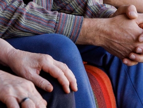 tight crop of three pairs of hands