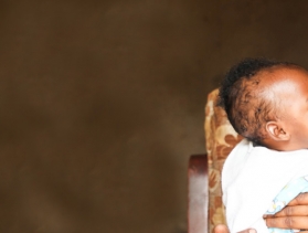 mother holds her child in Rwanda