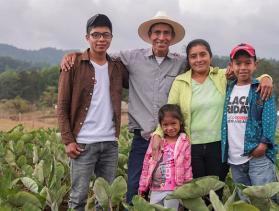 Nery García and his family pose on their farm in Honduras